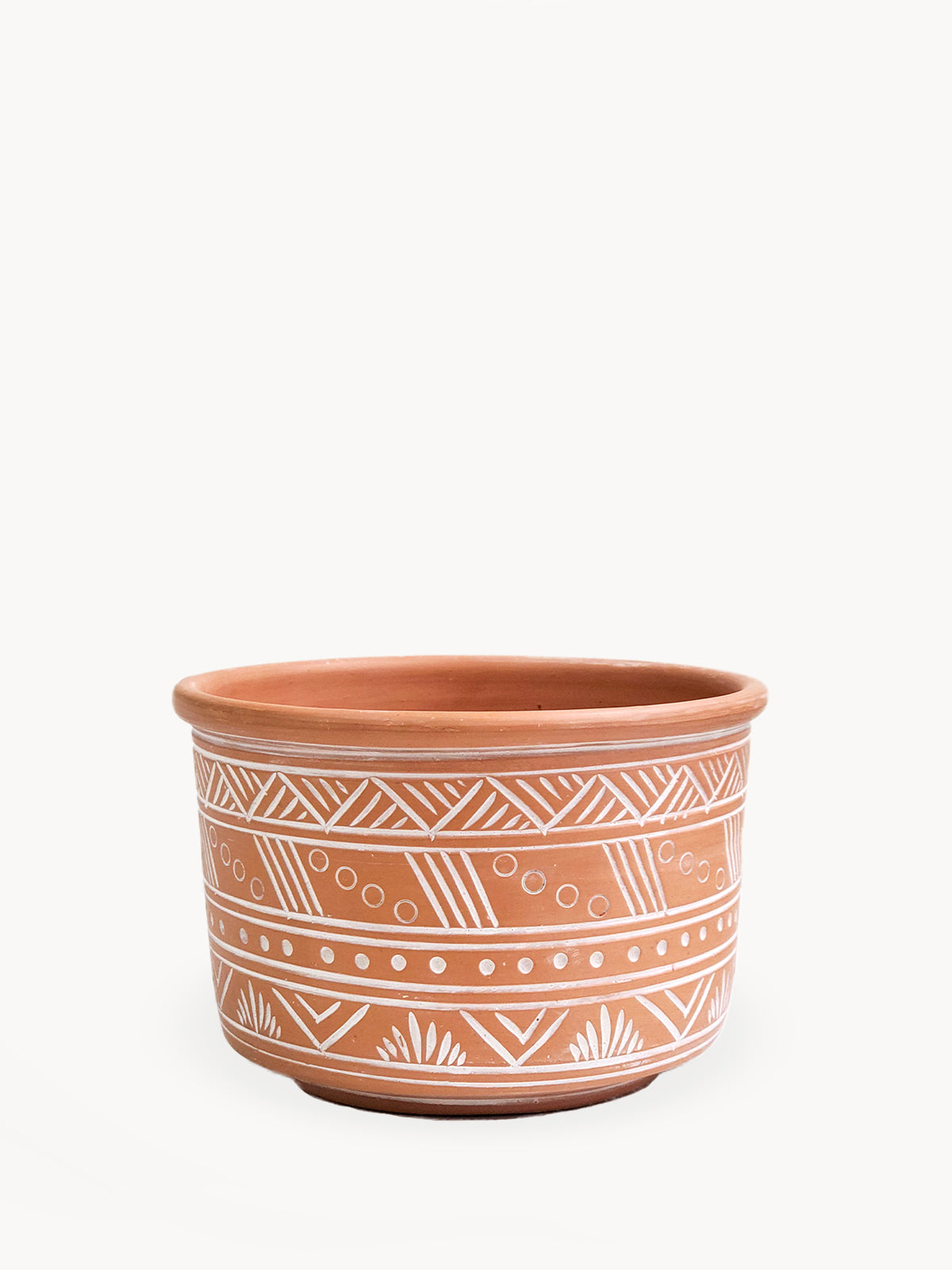 The Hand Etched Terracotta Pot - Large features a stunning artisan-inspired design, highlighted by intricate white geometric and floral patterns against a plain backdrop.