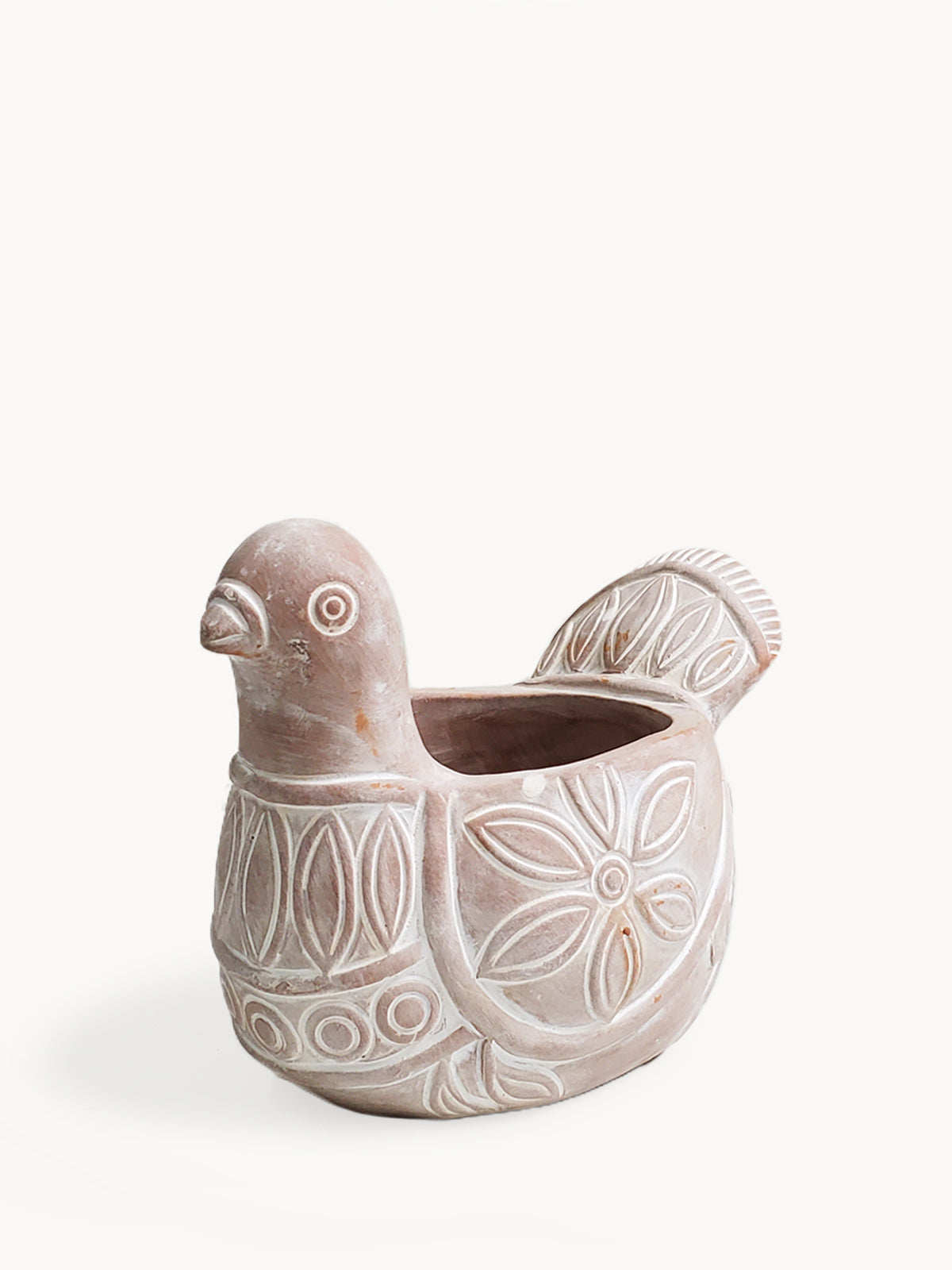 The Terracotta Pot - Spotted Dove is a whimsically crafted ceramic planter shaped like a bird, featuring detailed carved patterns on its body and tail. Made by Fair Trade artisans, it brings a delightful touch to any garden display.