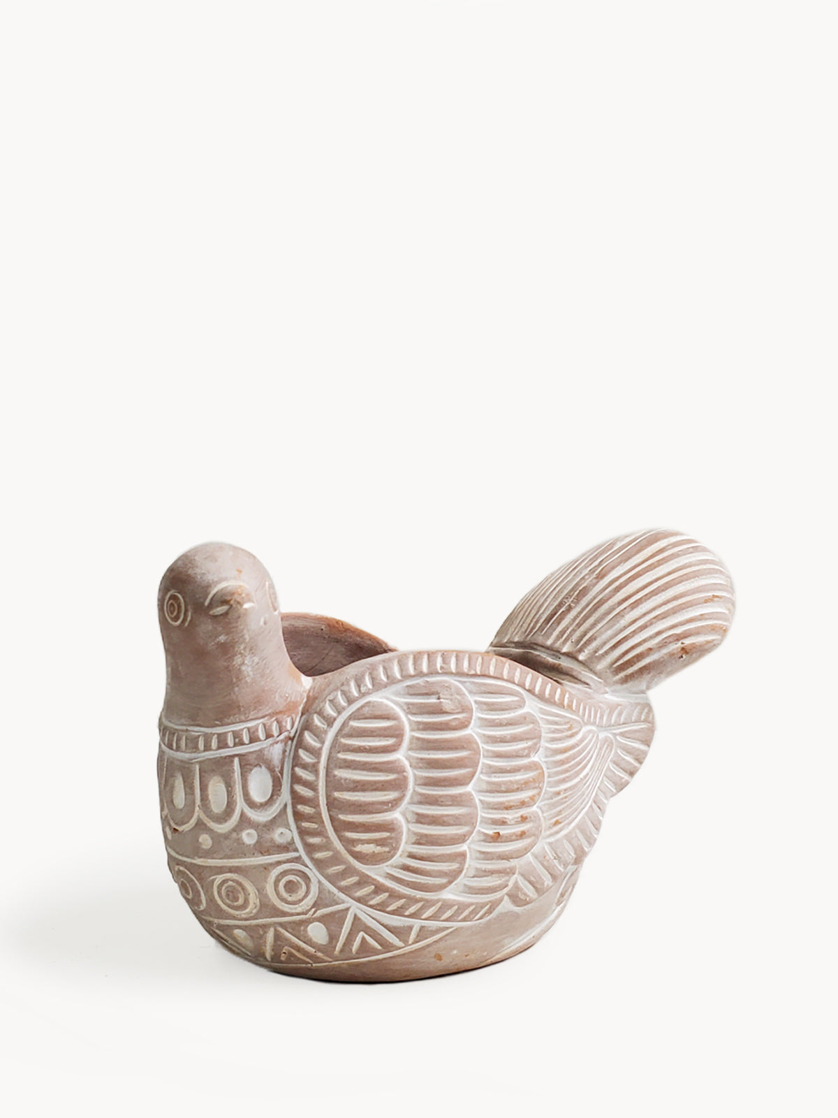 The Turtle Dove Terracotta Pot, intricately patterned and shaped like a graceful bird with a detailed tail, crafted meticulously by fair trade artisans, rests on a plain background.