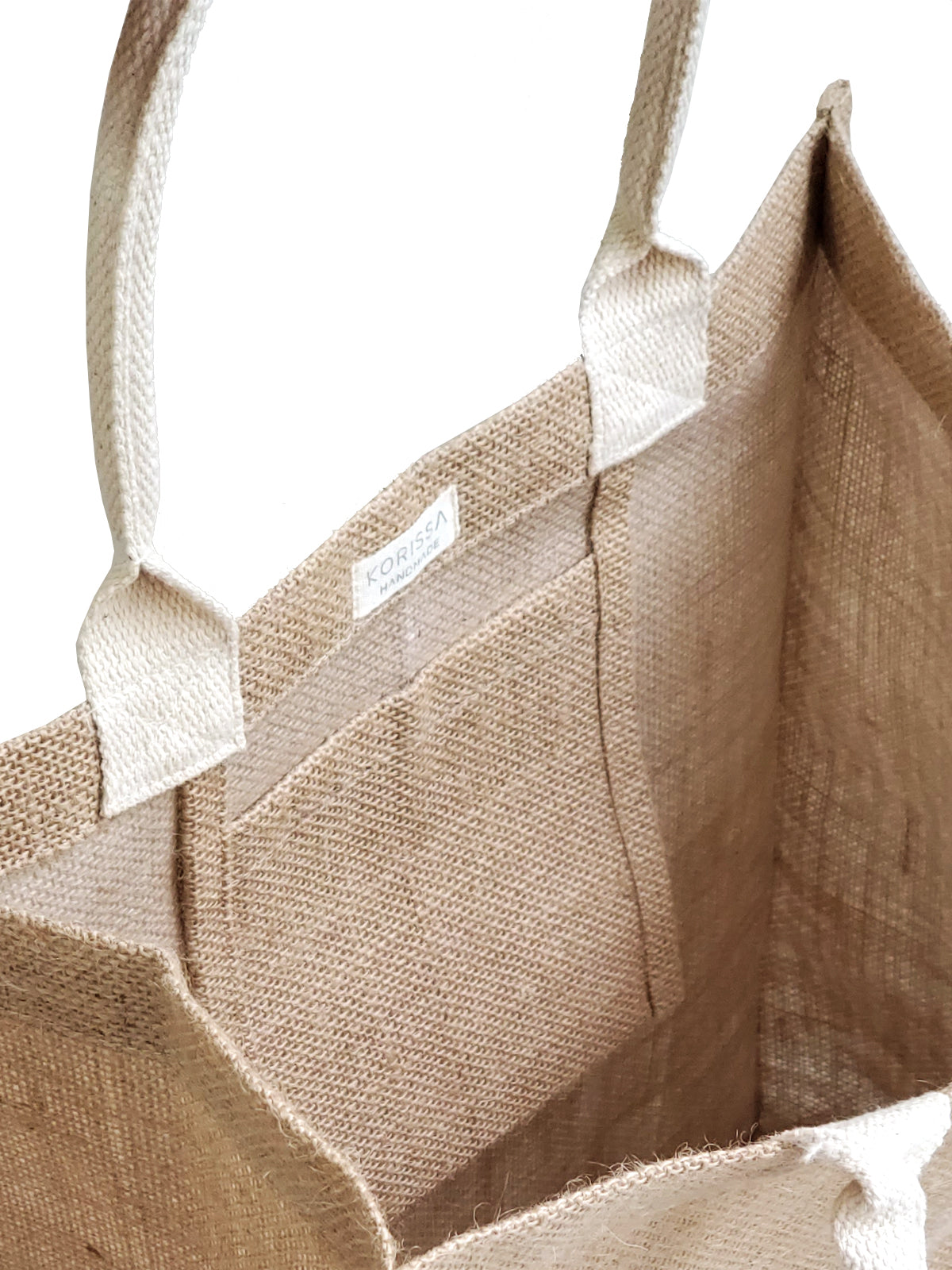 The Market Bag - Earth is a beige reusable jute bag featuring a simple white line drawing of a globe with small figures, representing people on Earth. Made by Fair Trade artisans, it's an ideal eco-friendly option for those who prioritize sustainability.