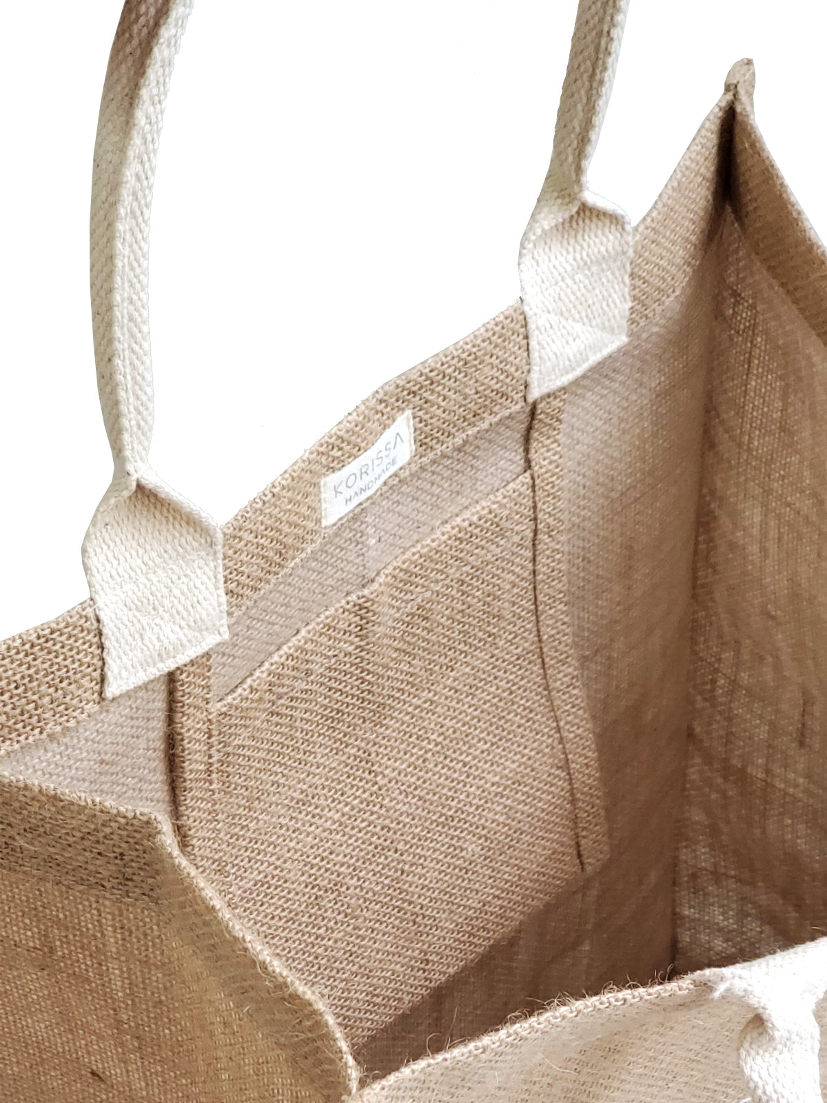 Introducing the Market Bag - Nature: a durable brown jute tote with two handles, adorned with an elegant white leaf design on the front. Handcrafted by Fair Trade artisans, this sustainable and reusable bag is ideal for any outing.