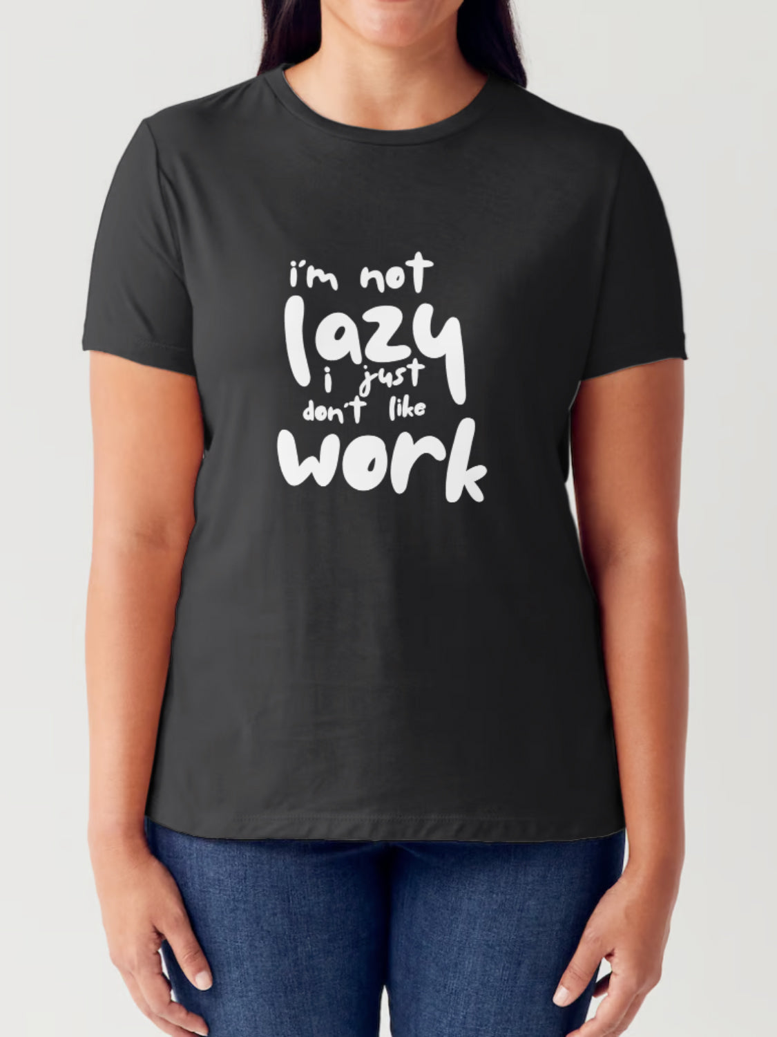 A person wearing a Simply Love Full Size "I'M NOT LAZY I JUST DON'T LIKE WORK" Letter Graphic Short Sleeve Tubular T-Shirt made from ringspun combed cotton, featuring the text "I'm not lazy, I just don't like work" written in white.