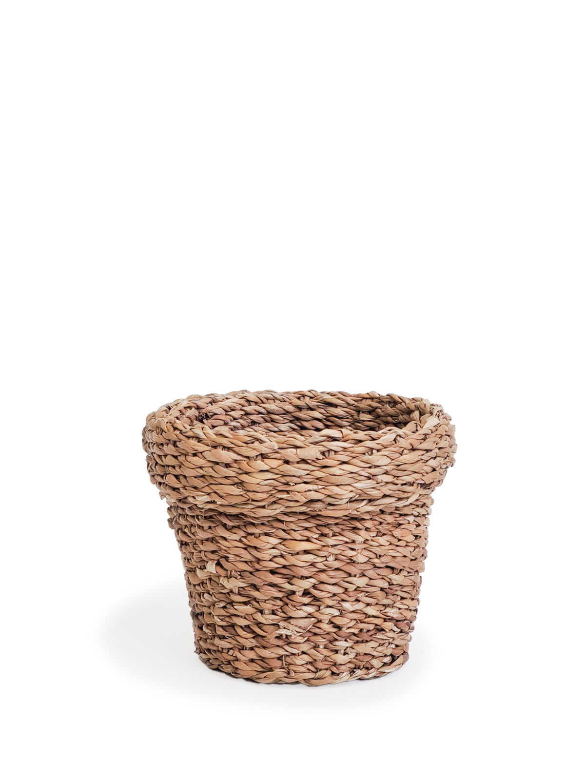 Three Savar Nesting Plant Baskets, crafted by Fair Trade artisans, feature white stripe accents. Two are stacked upright while one lies sideways on a plain background, showcasing their sustainable beauty.