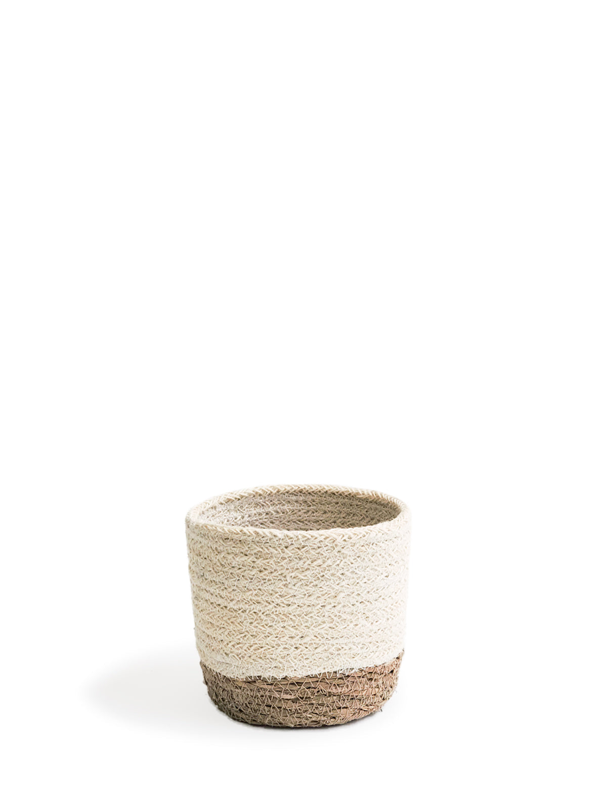 Three Savar Bins, woven sustainably by Fair Trade artisans in varying sizes, each featuring a beige upper half and a brown lower half, are arranged in a row.