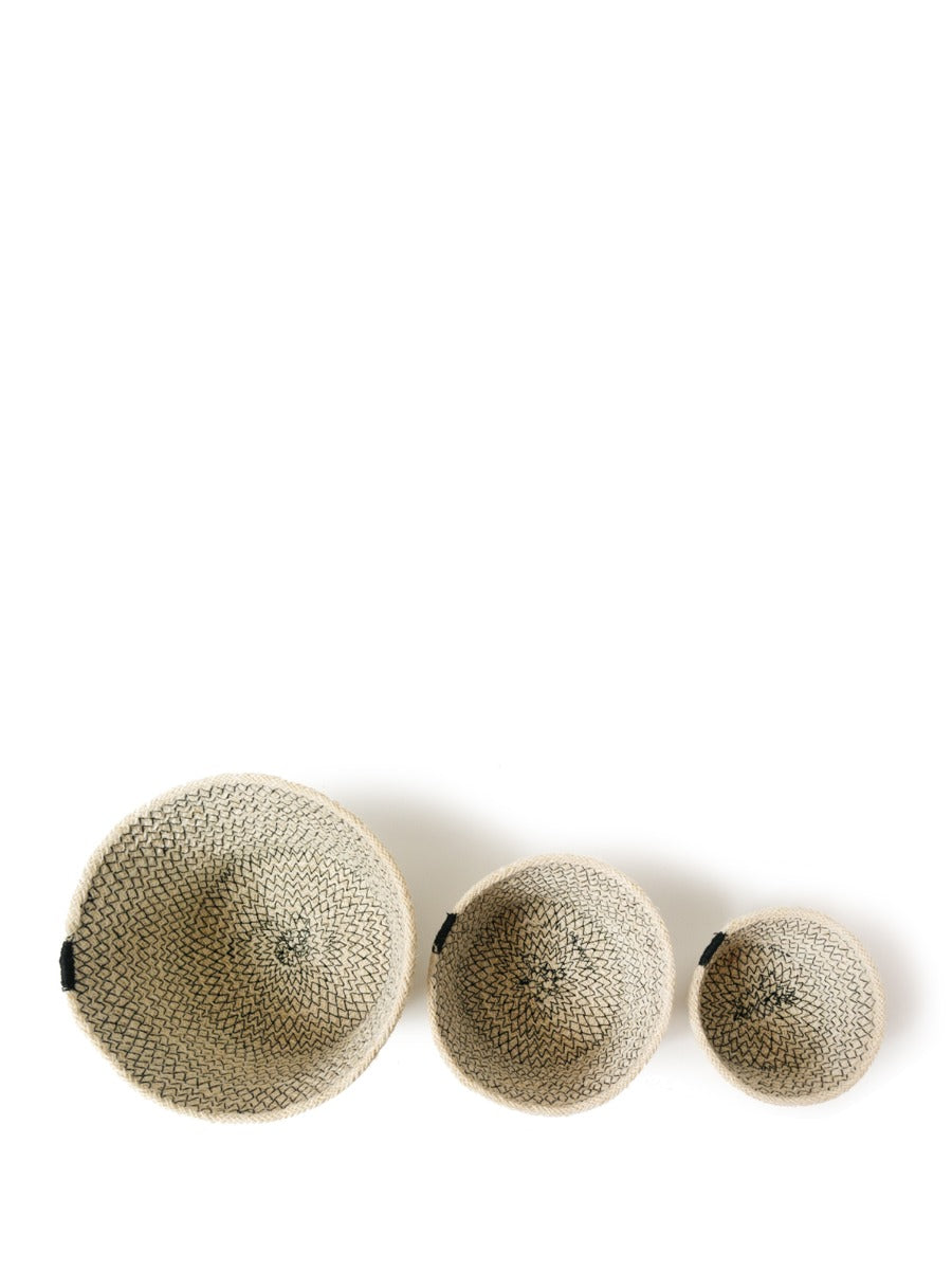 A set of three Amari Bowls in black, handmade beige woven jute baskets of varying sizes by Fair Trade artisans, arranged on a plain background.