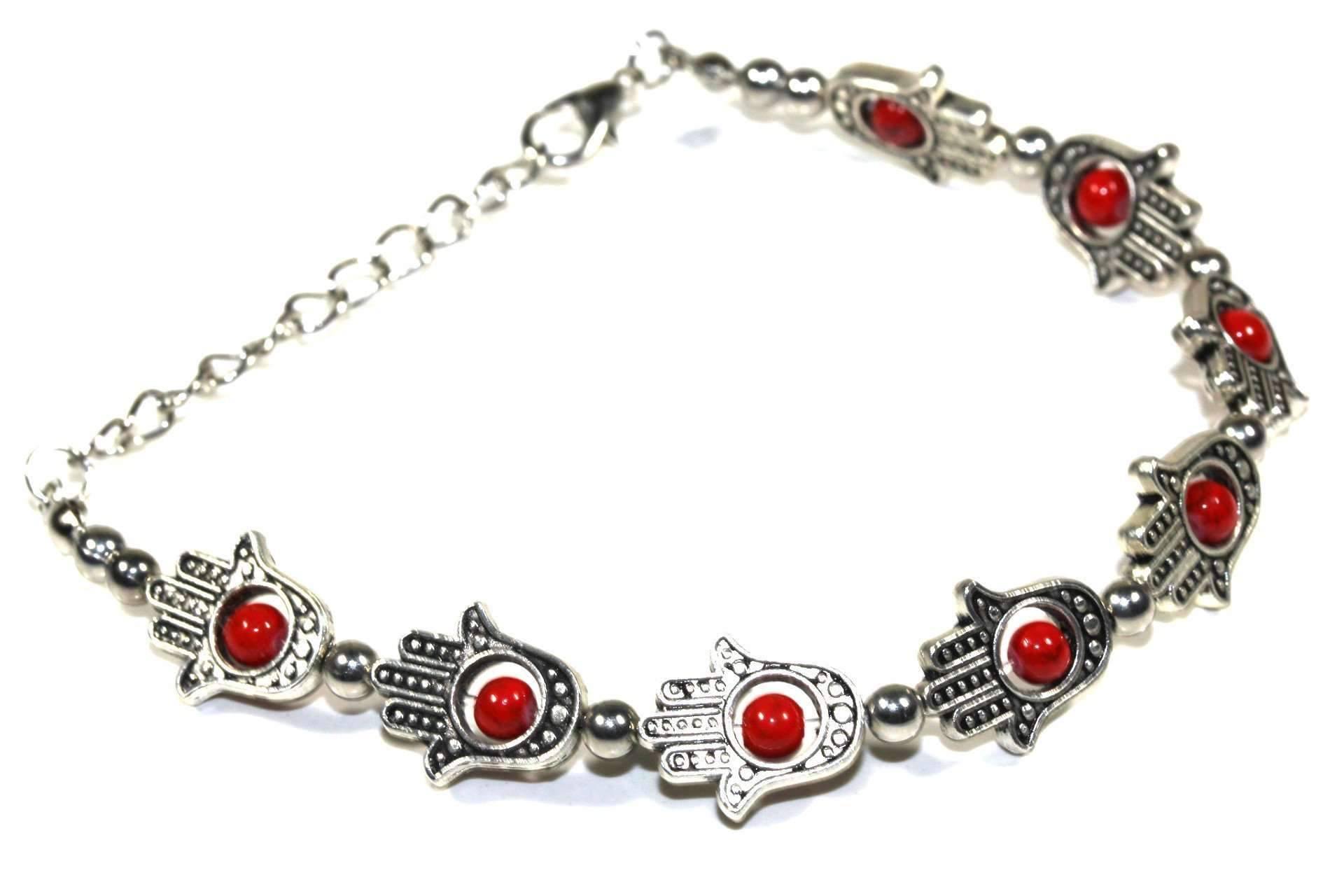 A bracelet with red beads, silver beads, and Hamsa Hands & Vibrant Bead charms for protection.