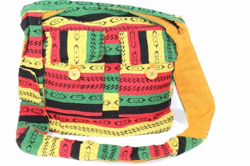 The Rasta Vibes Durrie Sling Bag is a colorful, handcrafted shoulder bag made from 100% cotton with vibrant red, yellow, green, and black stripes. It includes two small front pockets with wooden buttons, embodying traditional Rasta colors.