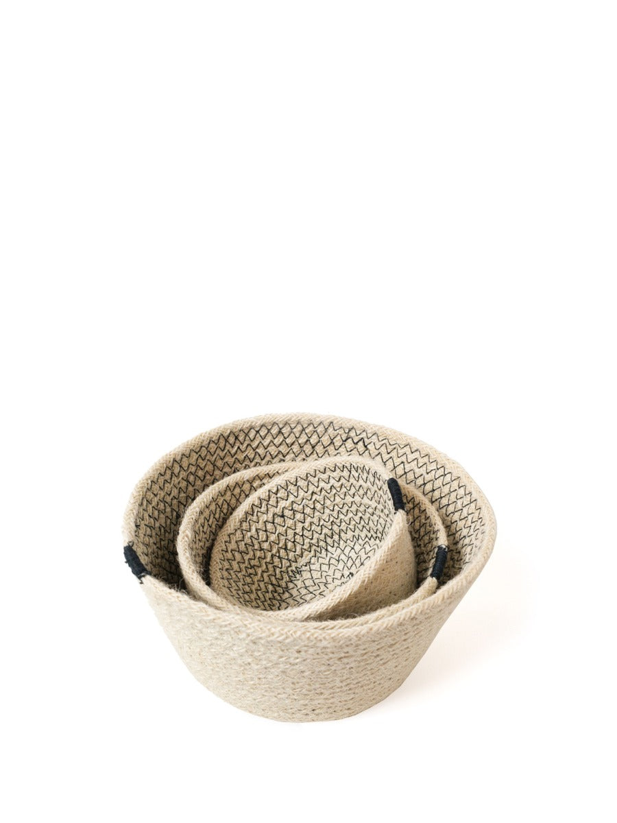 Amari Bowl - Black (Set of 3) features a minimalistic design with three beige woven baskets in different sizes, accented by black bands, crafted by Fair Trade artisans.