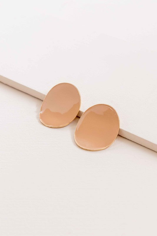 Round beige On a Curve stud earrings with a gold rim on a thin line against a white background.