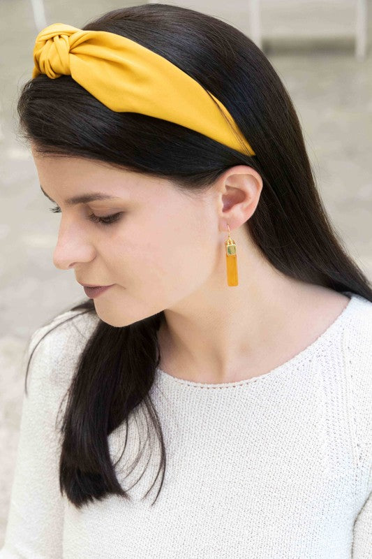 Pair of Dynasty Dangle Hook Earrings on a light background.