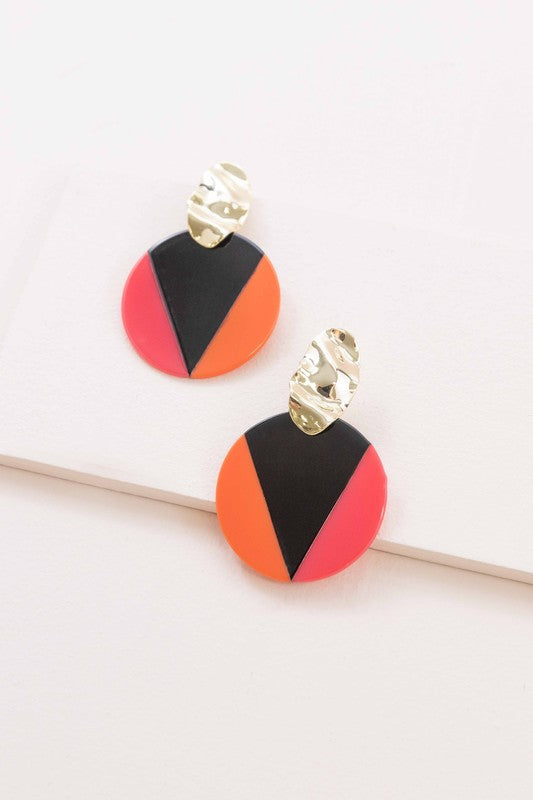 A pair of Color Block Drop Earrings with gold-tone hardware and geometric black and teal design.