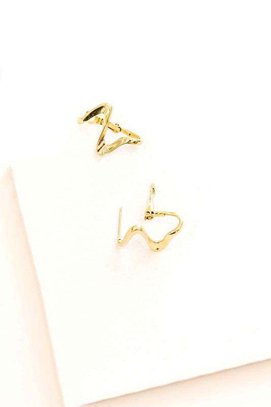 Too Wavy Hoop Earrings on a white surface.