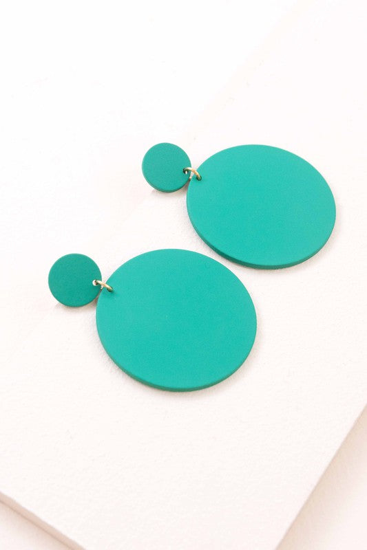 A pair of En Vogue Dangle Earrings in teal color against a white background.