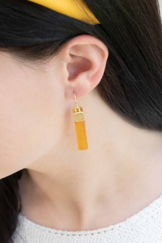 Pair of Dynasty Dangle Hook Earrings on a light background.