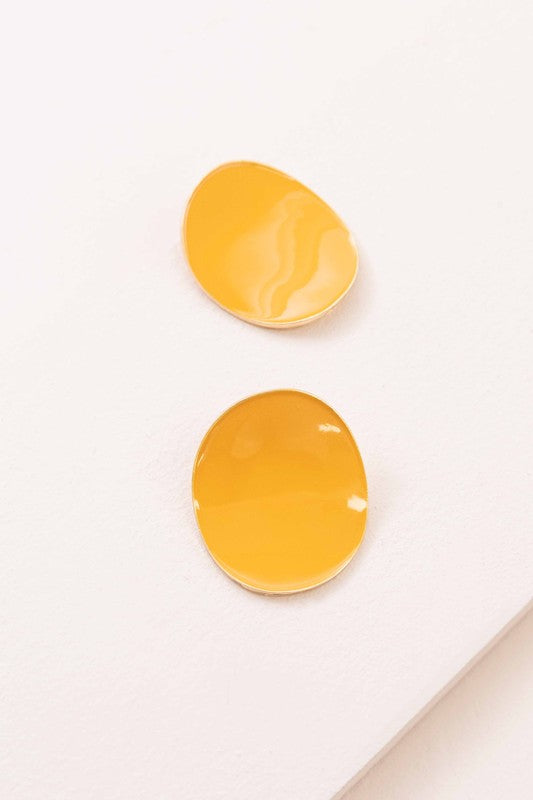Round beige On a Curve stud earrings with a gold rim on a thin line against a white background.