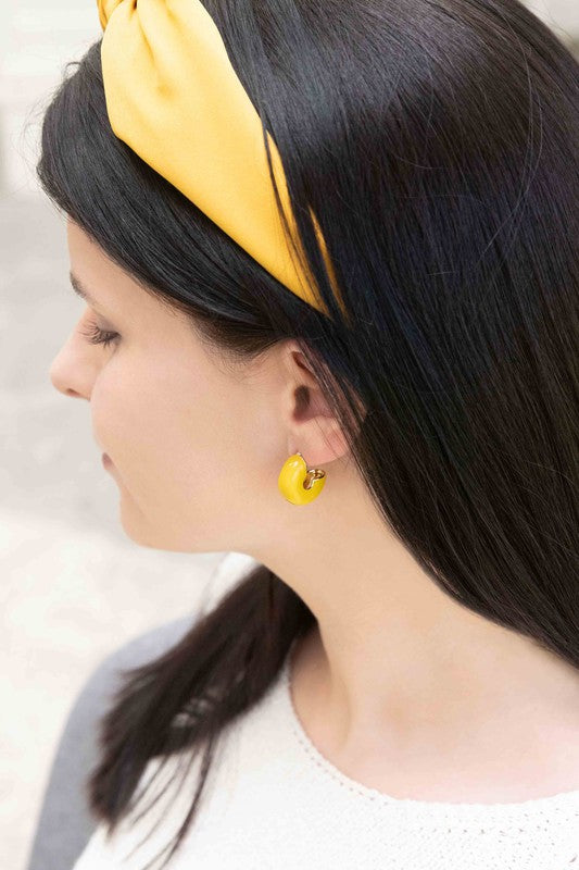 A pair of Thick Mini Hoop Earrings displayed on a white background.