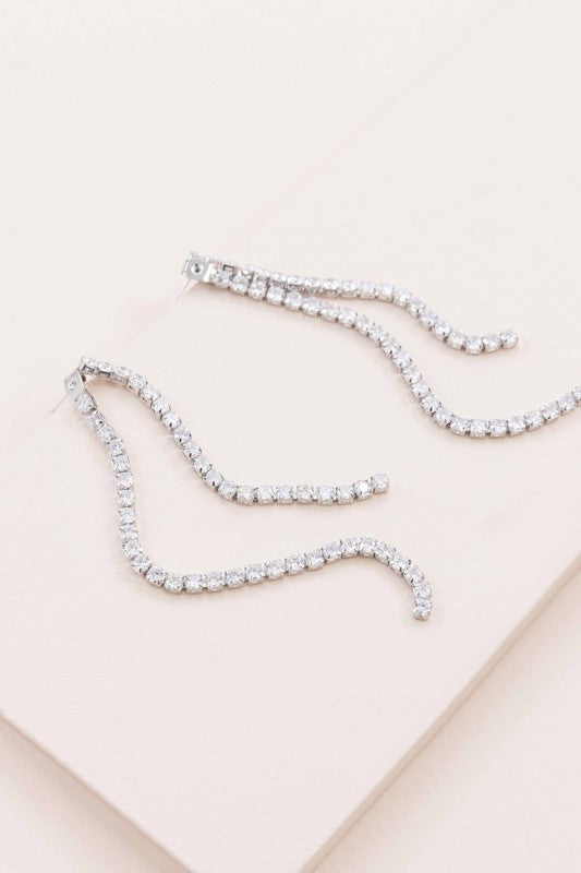 A pair of Evening Gala Ear Jacket Earrings displayed on a white surface.