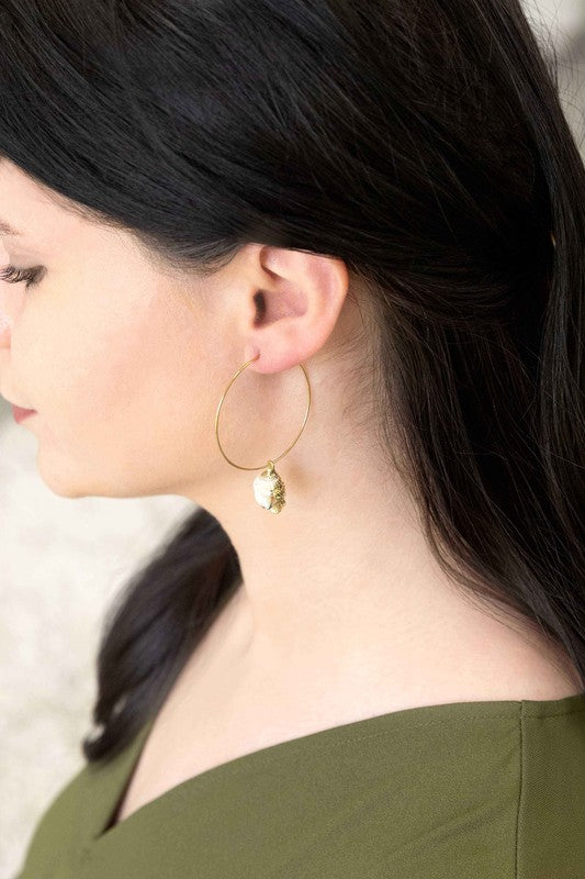 Ocean Calls Hoop Earrings - 14K with conch shell pendants against a white background.