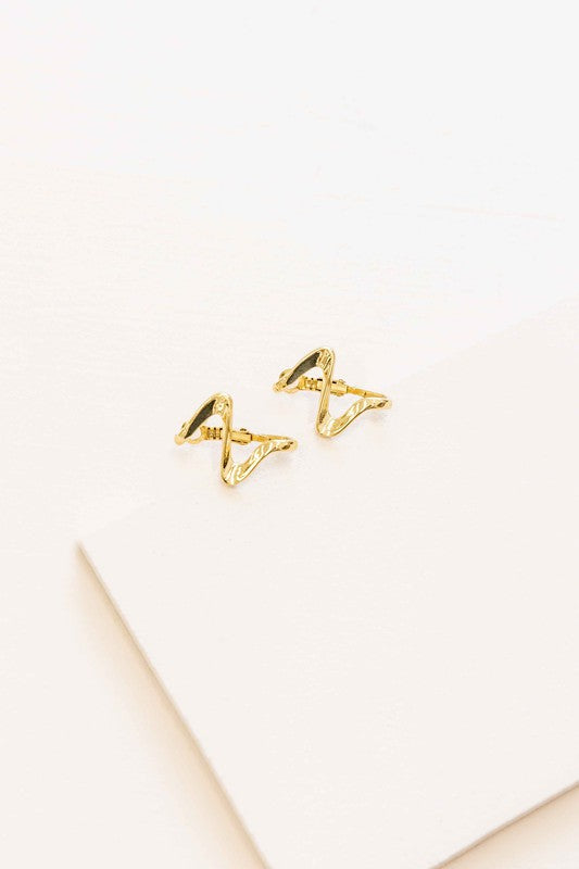 Too Wavy Hoop Earrings on a white surface.