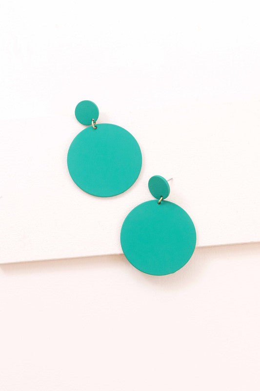 A pair of En Vogue Dangle Earrings in teal color against a white background.