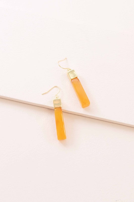 Pair of Dynasty Dangle Hook Earrings on a light background.