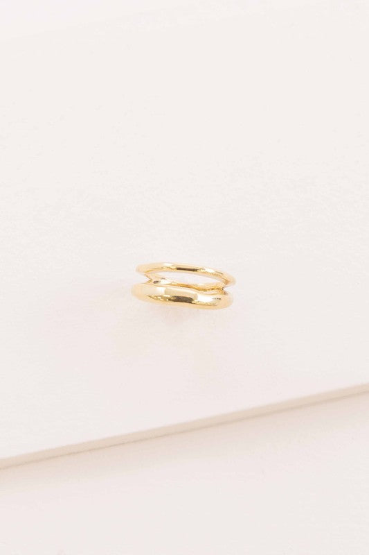 Double Layer Ring placed on a white surface with a soft shadow.