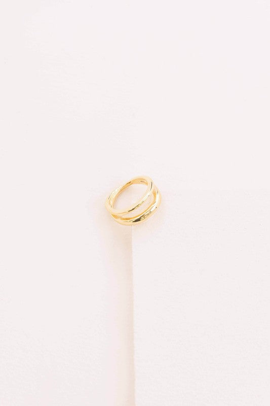 Double Layer Ring placed on a white surface with a soft shadow.