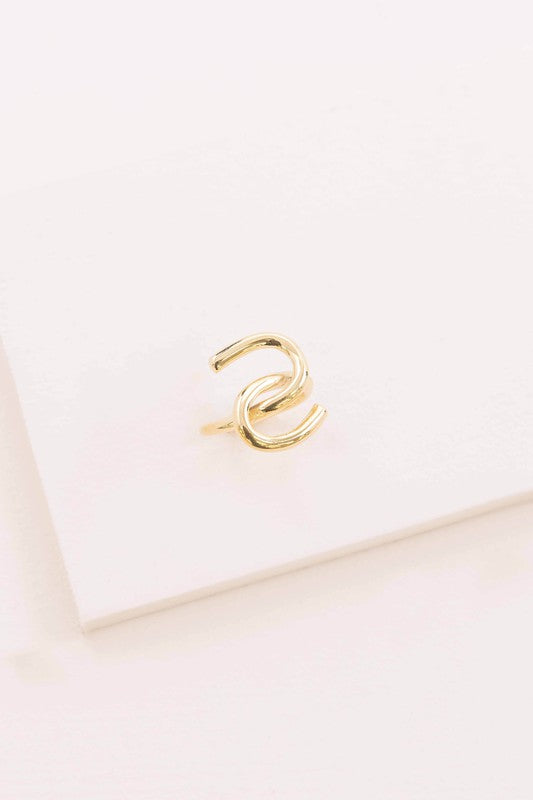 14k gold Tie and Knot Ring presented on a white surface.