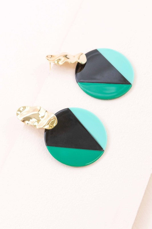 A pair of Color Block Drop Earrings with gold-tone hardware and geometric black and teal design.