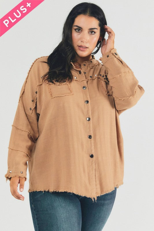 A person with dark hair wearing a Plus Distressed Hem Button Down Oversize Shirt and jeans stands against a light background, embodying casual comfort.