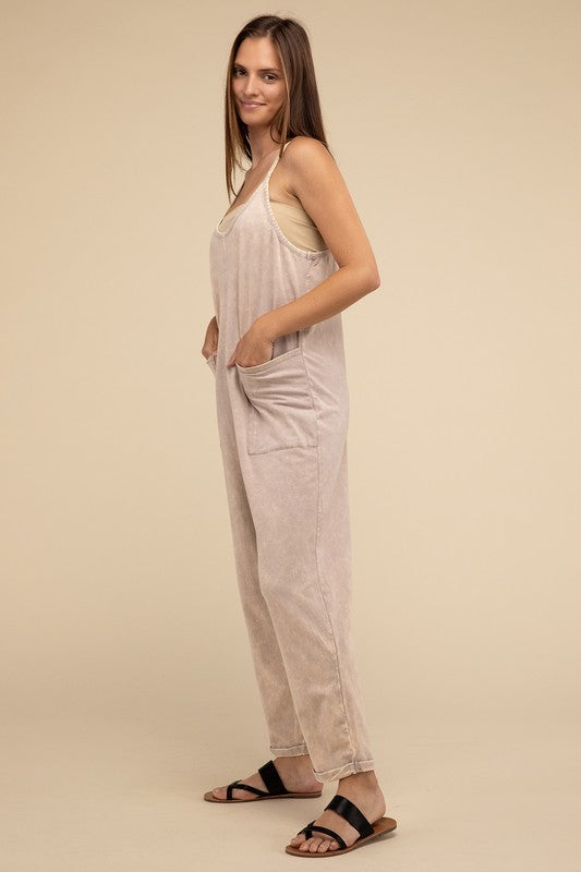 Woman standing and posing in a studio, wearing casual comfort style green Washed Spaghetti Straps Overalls with Pockets and sandals.