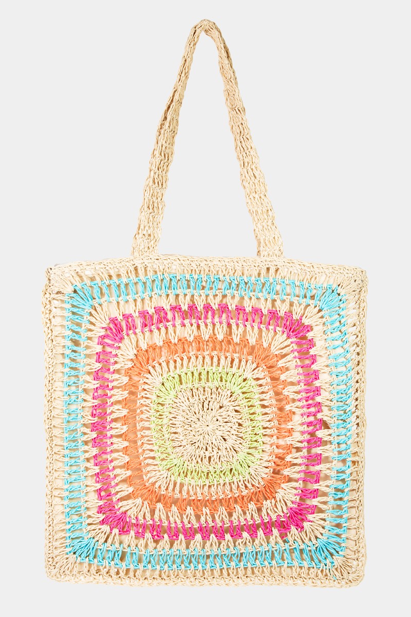 The Fame Rainbow Crochet Knit Tote Bag is a vibrant and stylish square-shaped woven straw bag showcasing colorful patterns in blue, beige, orange, pink, and green. It features two handles and has a crochet knit design that adds an artisanal touch.