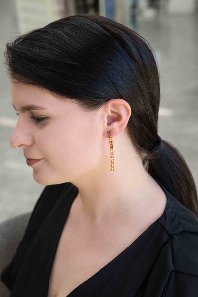 A whimsical, Candy Stone Dangle Earrings and bracelet set on a white background.