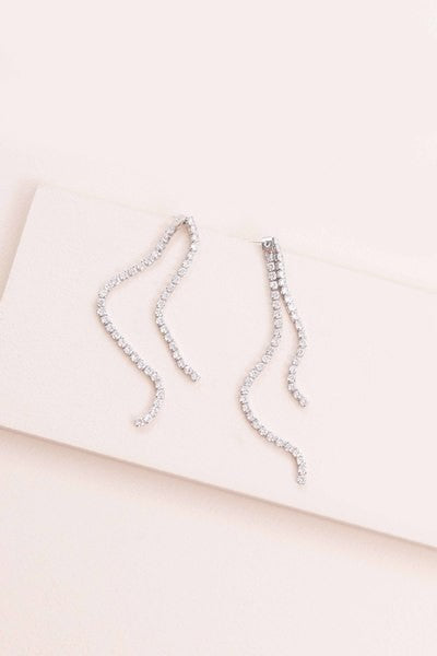 A pair of Evening Gala Ear Jacket Earrings displayed on a white surface.