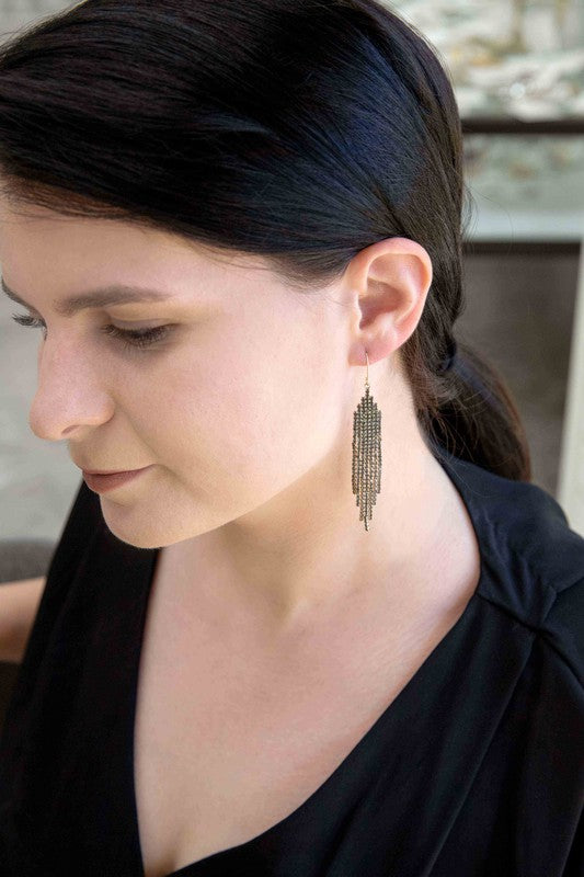 Pixel Stone dangle beaded tassel earrings displayed on a white background.