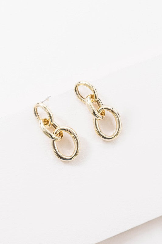 The Let's Link Up Earrings, featuring a pair of gun-metal chained drop design with sterling silver posts, are elegantly showcased on a light background.