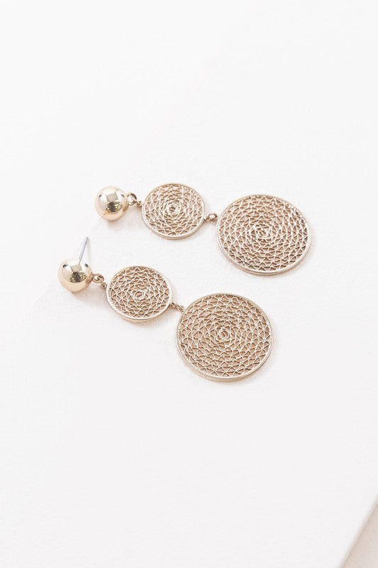 The exquisite Golden Webbed Earrings, crafted from brass with a gold-tone finish, showcase round, three-tiered drop earrings featuring an intricate webbed lattice design and are elegantly displayed on a white surface.