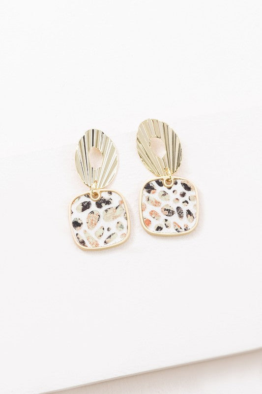 A pair of Stepping Stones Drop Earrings with patterned pendants on a white background.