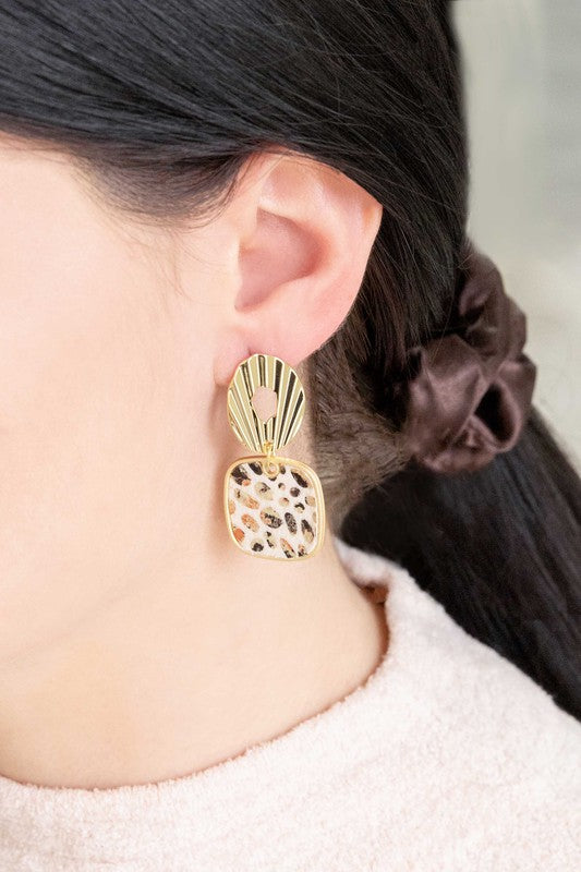 A pair of Stepping Stones Drop Earrings with patterned pendants on a white background.