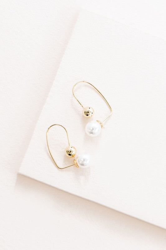 Pearl Hoop Earrings with 14k Gold plate accents on a white background.