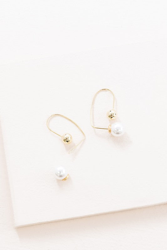 Pearl Hoop Earrings with 14k Gold plate accents on a white background.