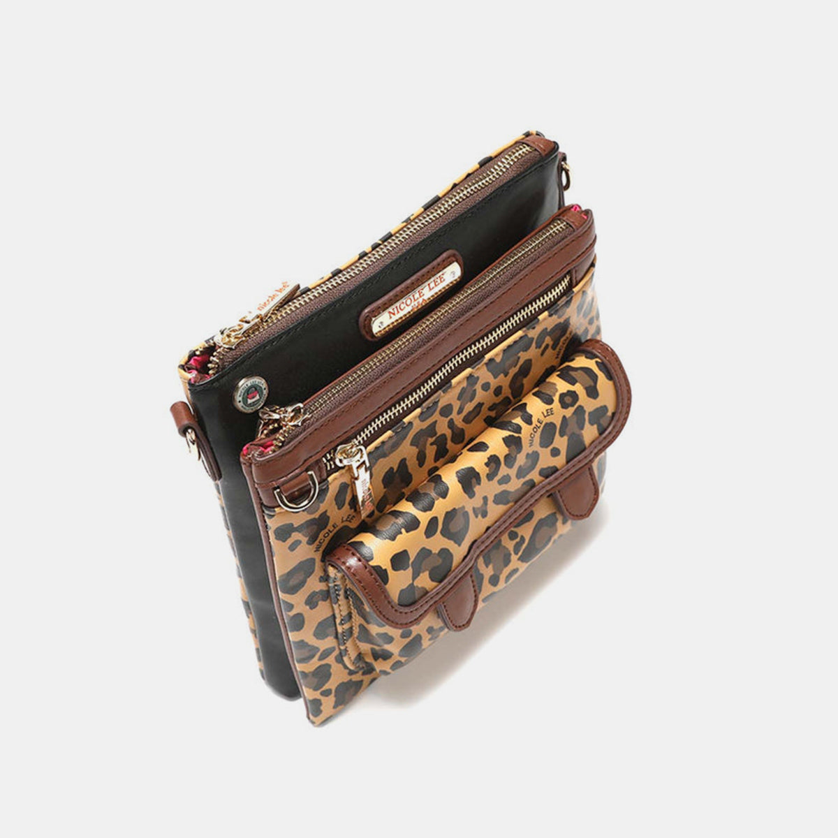 The Nicole Lee USA Leopard crossbody bag is made from vegan leather and showcases a leopard print design. It features a front pocket, a zippered closure, gold-tone hardware, brown trim, and a black panel at the top that is embellished with a brand label.