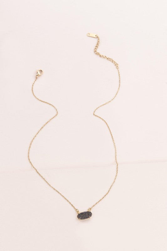 Marquise Druzy Necklace with a blue gemstone pendant on a white background.