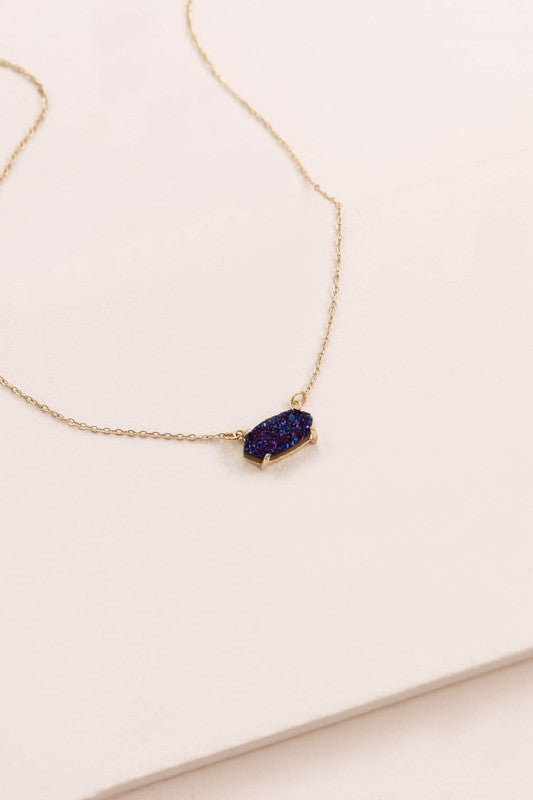 Marquise Druzy Necklace with a blue gemstone pendant on a white background.