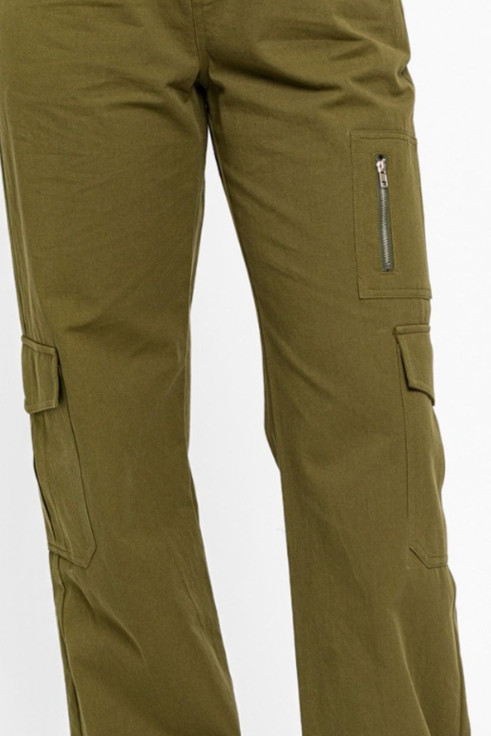   Person wearing the Le Lis High Waisted Wide Leg Cargo Pants with Pockets, featuring side pockets and zipper details, standing against a plain white background.