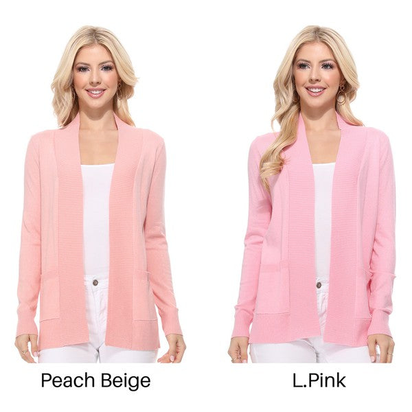 A person wearing a light yellow Open Front Shrug Sweater Knit Cardigan over a white shirt is standing against a white background.