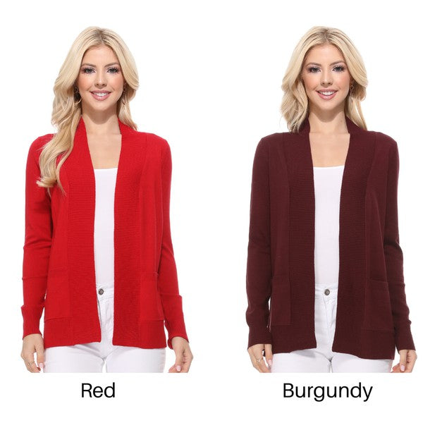 A person wearing a light yellow Open Front Shrug Sweater Knit Cardigan over a white shirt is standing against a white background.