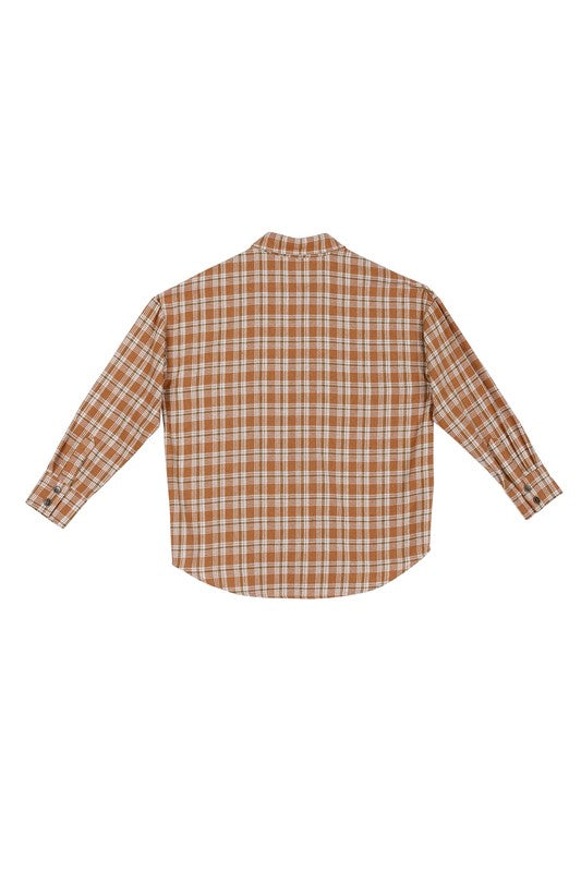 Wearing an Autumn beige plaid shirt, a person with long hair complements their look with hoop earrings, showcasing the season's warm hues. This long-sleeved shirt rests gracefully against a beige backdrop and is ideal for machine wash cold care.