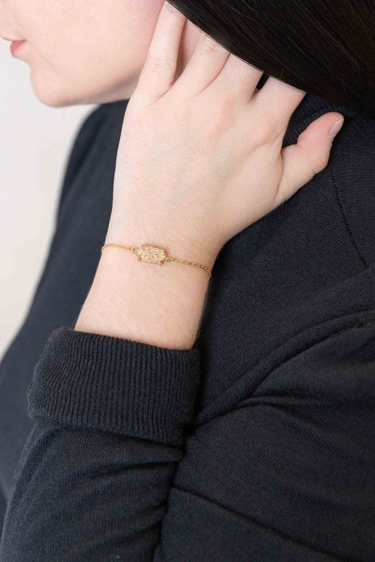 Marquise Druzy Bracelet with a 14k gold plated, rectangular, multicolored glitter pendant.