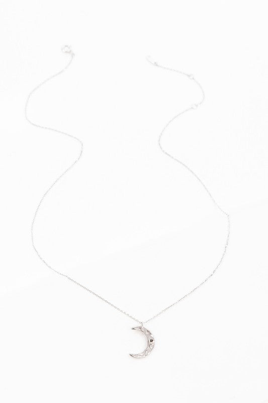 Crescent Moon Hammered Necklace on a delicate chain against a white background.